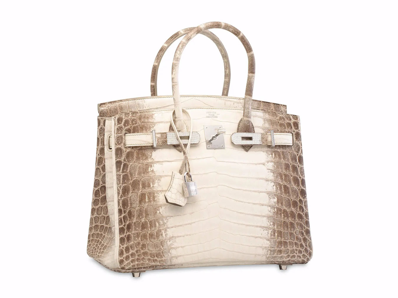 Instantly recognisable, the Hermès Birkin - the most expensive handbag ever sold. Made with Himalayan crocodile skin, 18 karat white gold and diamond hardware detailing on the fastener.